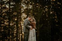 Bride and groom hugging in a forest at their vow renewal in Germany.