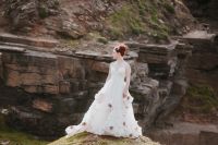 White ruffled bridal dress with flowers for an elopement in Europe
